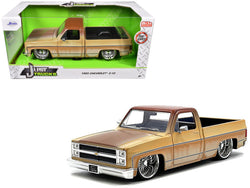 1985 Chevrolet C-10 Pickup Truck Yellow with Brown Top (Rusted) and Daytona Wire Wheels "Just Trucks" Series 1/24 Diecast Model by Jada